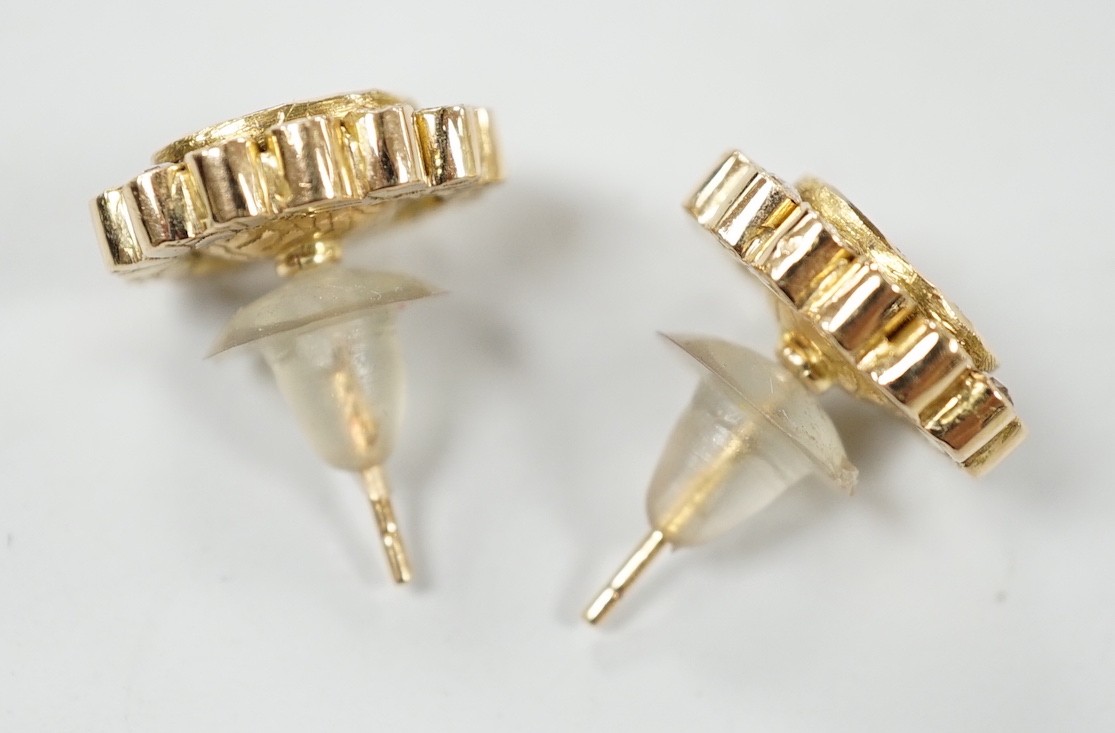 A pair of Indian yellow metal, flat and rose cut diamond set oval cluster earrings, 15mm by 13mm, gross weight 7.8 grams.